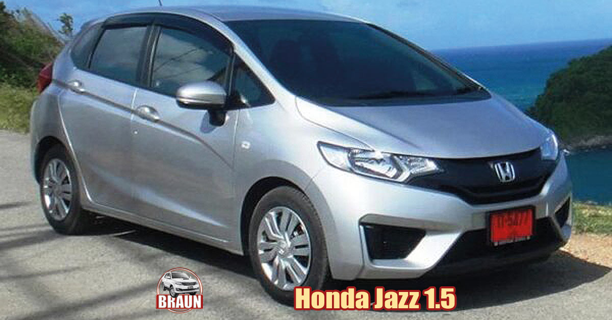 silver honda jazz car rental parked on a south west phuket coast road with a wonderful view of the andaman sea and small islands